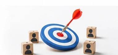 Blue and white target with a red dart in the bullseye, surrounded by four wooden blocks showing person silhouettes.